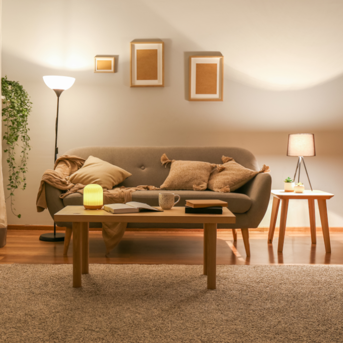 A softly lit living room with table lamps and a floor lamp